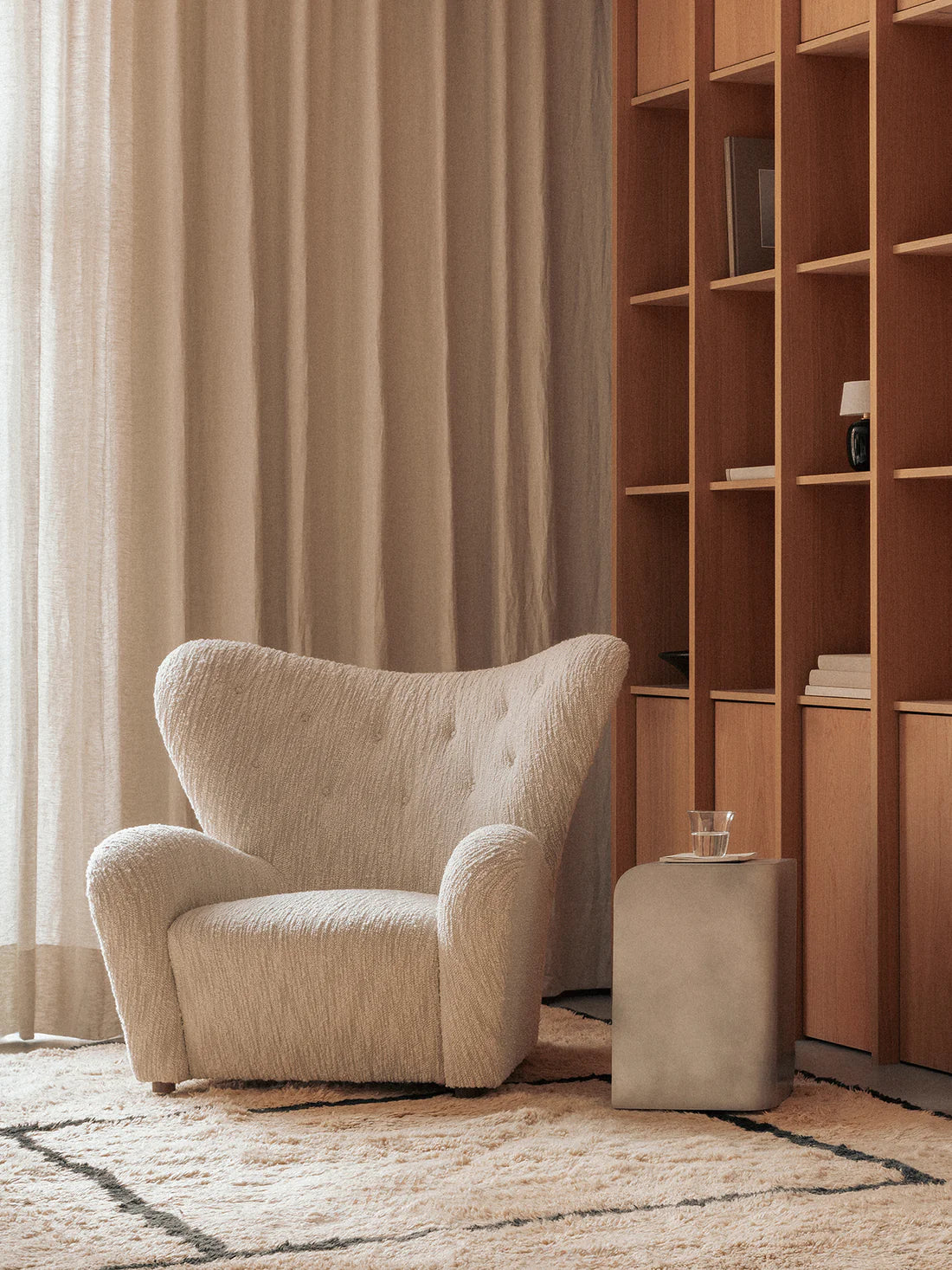 Volume Side Table next to lounge chair in living room.