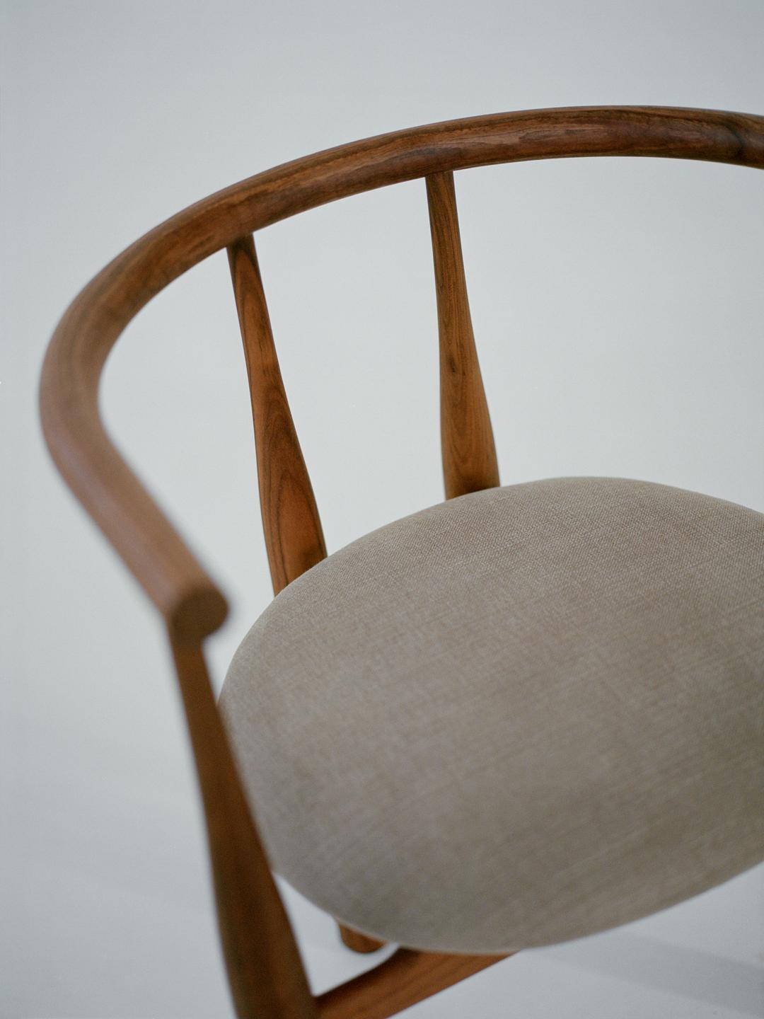 A close up of the Bukowski Chair Walnut Romo Linara 342
