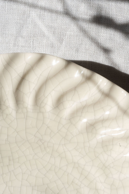 Close-up of the Dashi Plate White Crackled Glaze L by Jars Ceramistes.