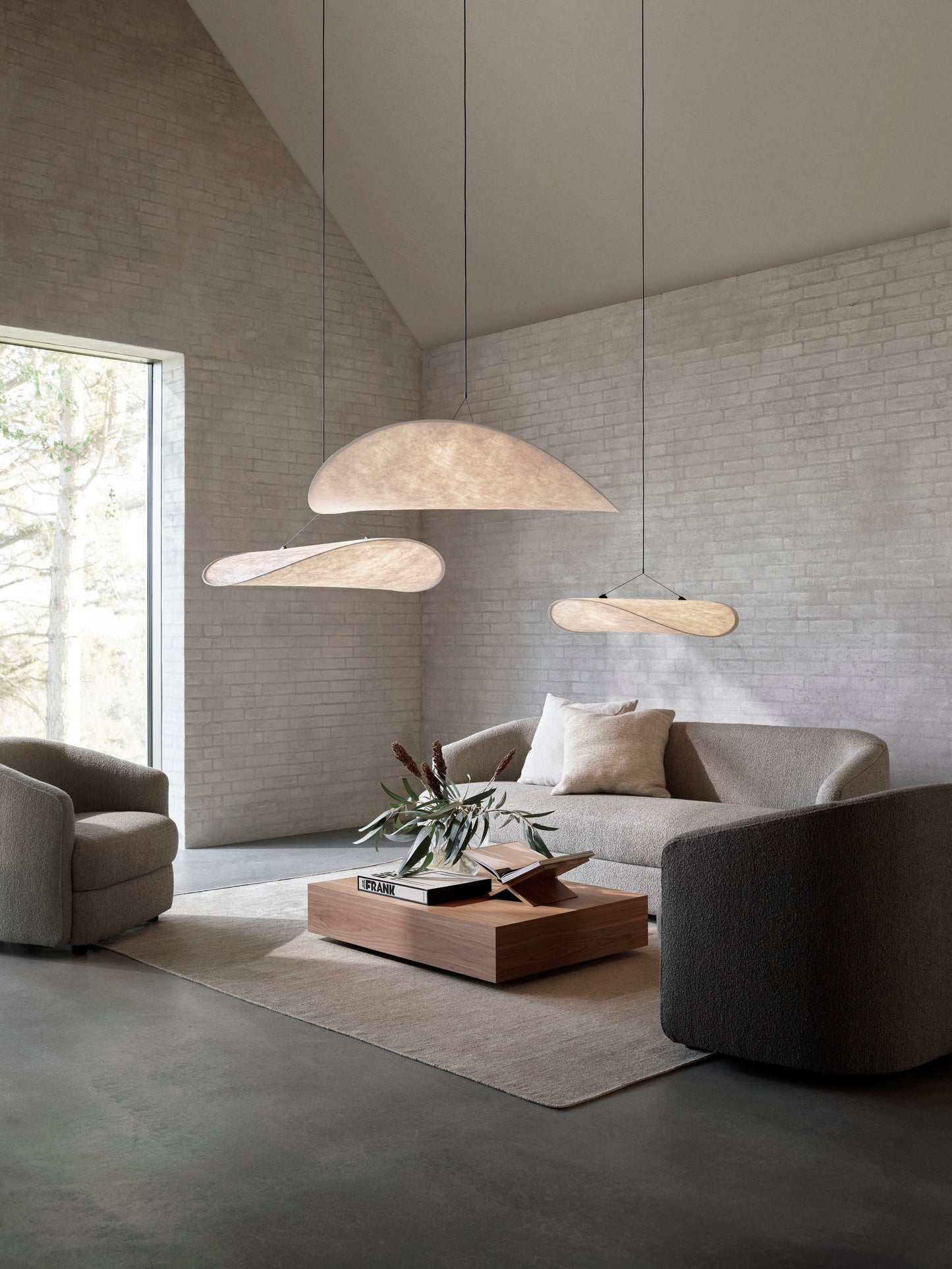 Tense Pendant Lamps by New Works hanging in modern design interior living room with Covent Sofa and Chairs.