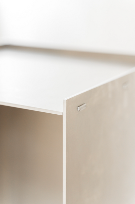 Close-up of the Rivet Box Side Table, highlighting its sturdy construction and intricate details. A celebration of craftsmanship and the raw beauty of untreated aluminum.