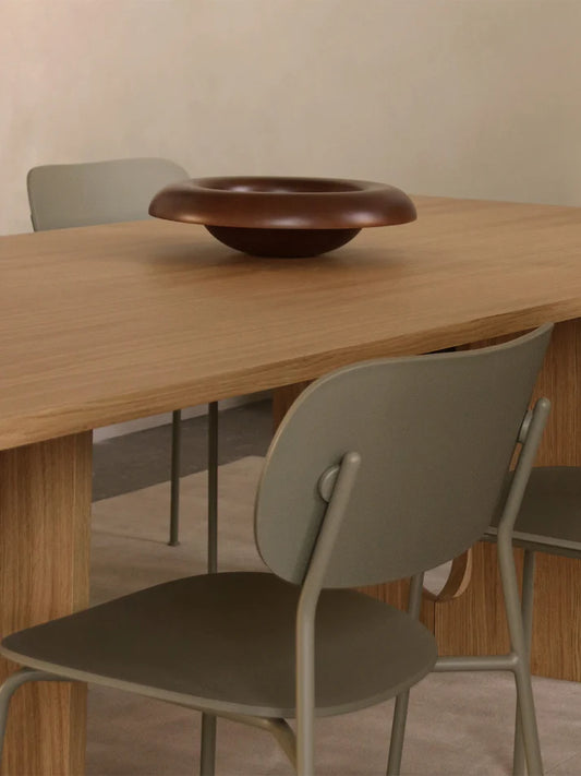 closup picture from the audo copenhagen do dining chair without armrests at wood dining table.
