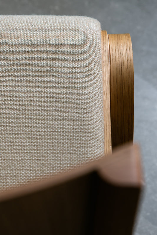 A close up of the Ready Dining Chair Front Upholstered in Natural Oak & Audo Bouclé 02 by Audo Copenhagen.