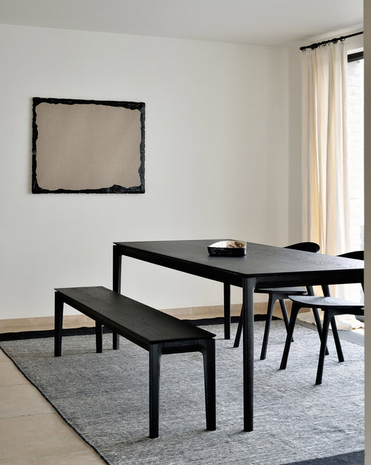 Dining table with Bok Bench in Black Oak by Ethnicraft