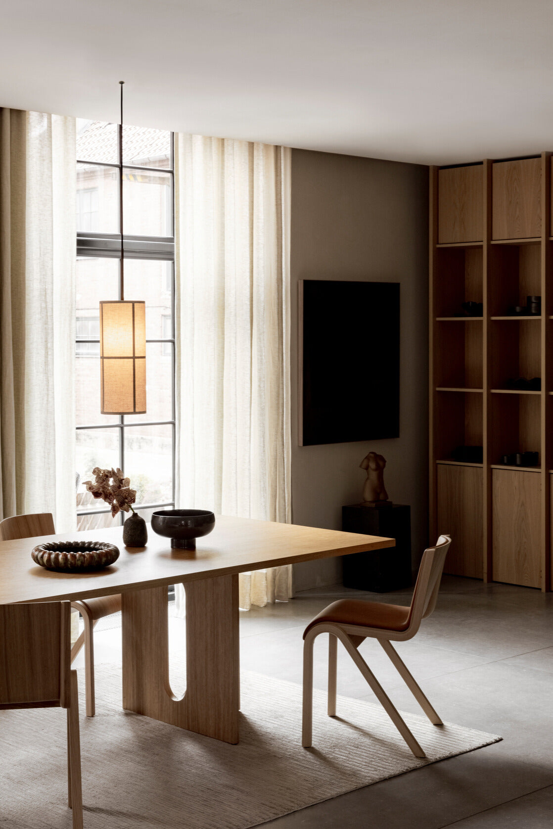 The Natural oak Ready Dining Chair Front Upholstered at a dining table by Audo Copenhagen.