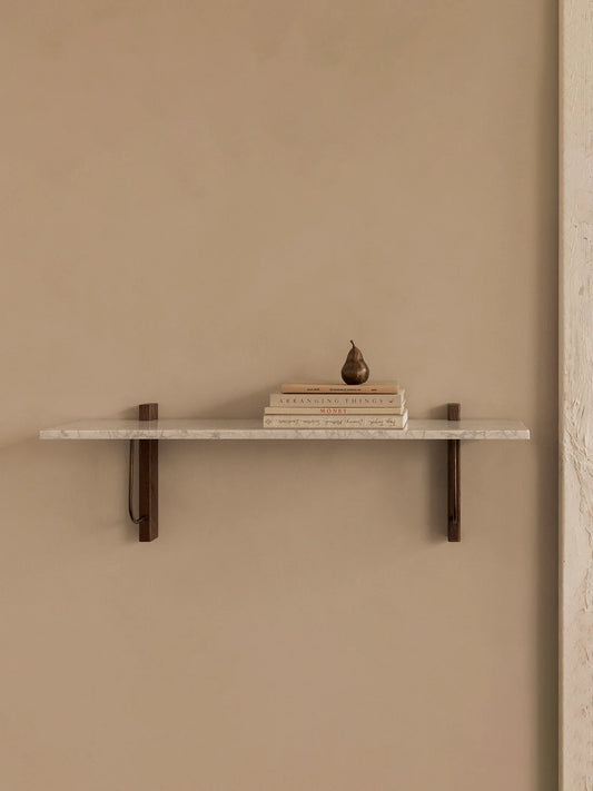 Audo Corbel Wall Shelf White Marbel with books and decoration