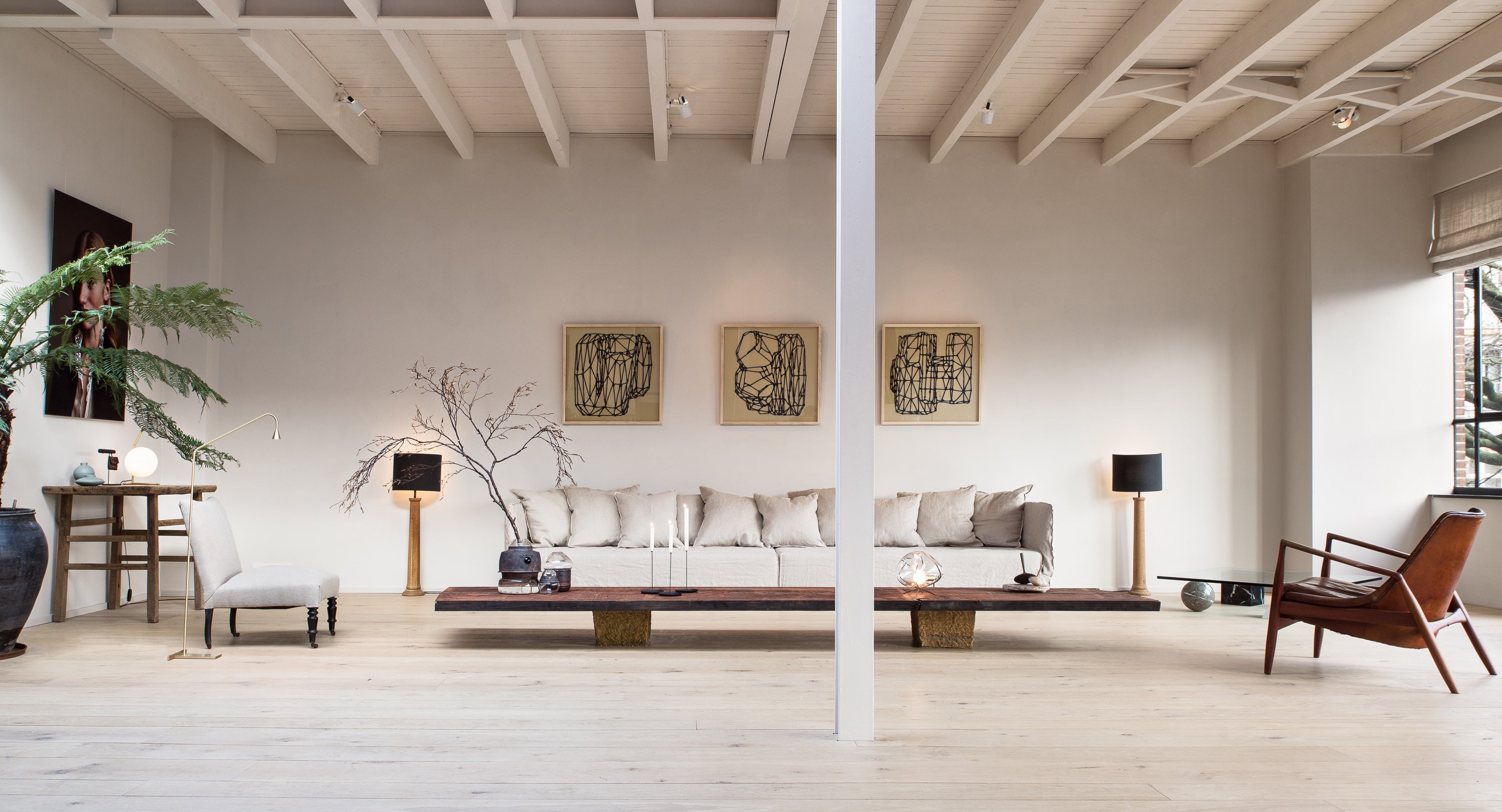 Enter The Loft IV Edition - a neutral light lofty space filled with design furniture.