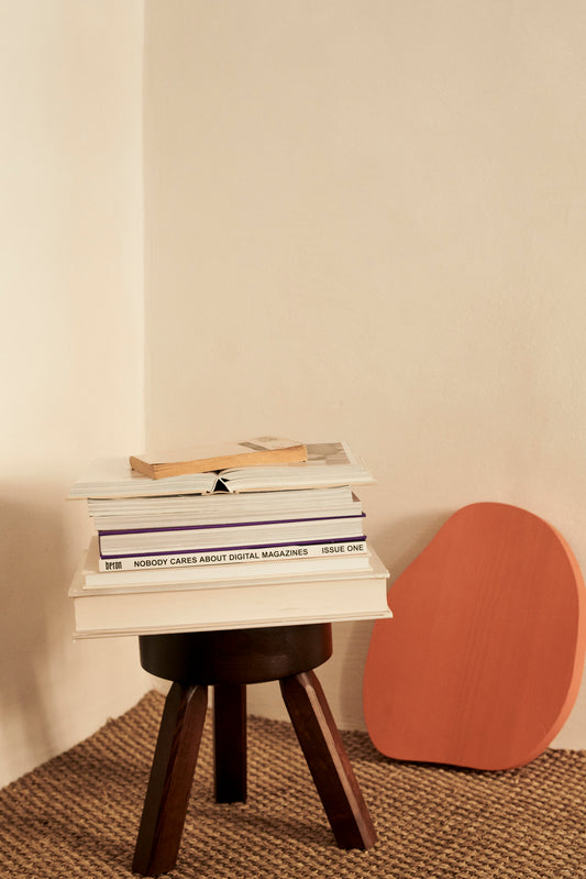 Frama AML stool with books on it