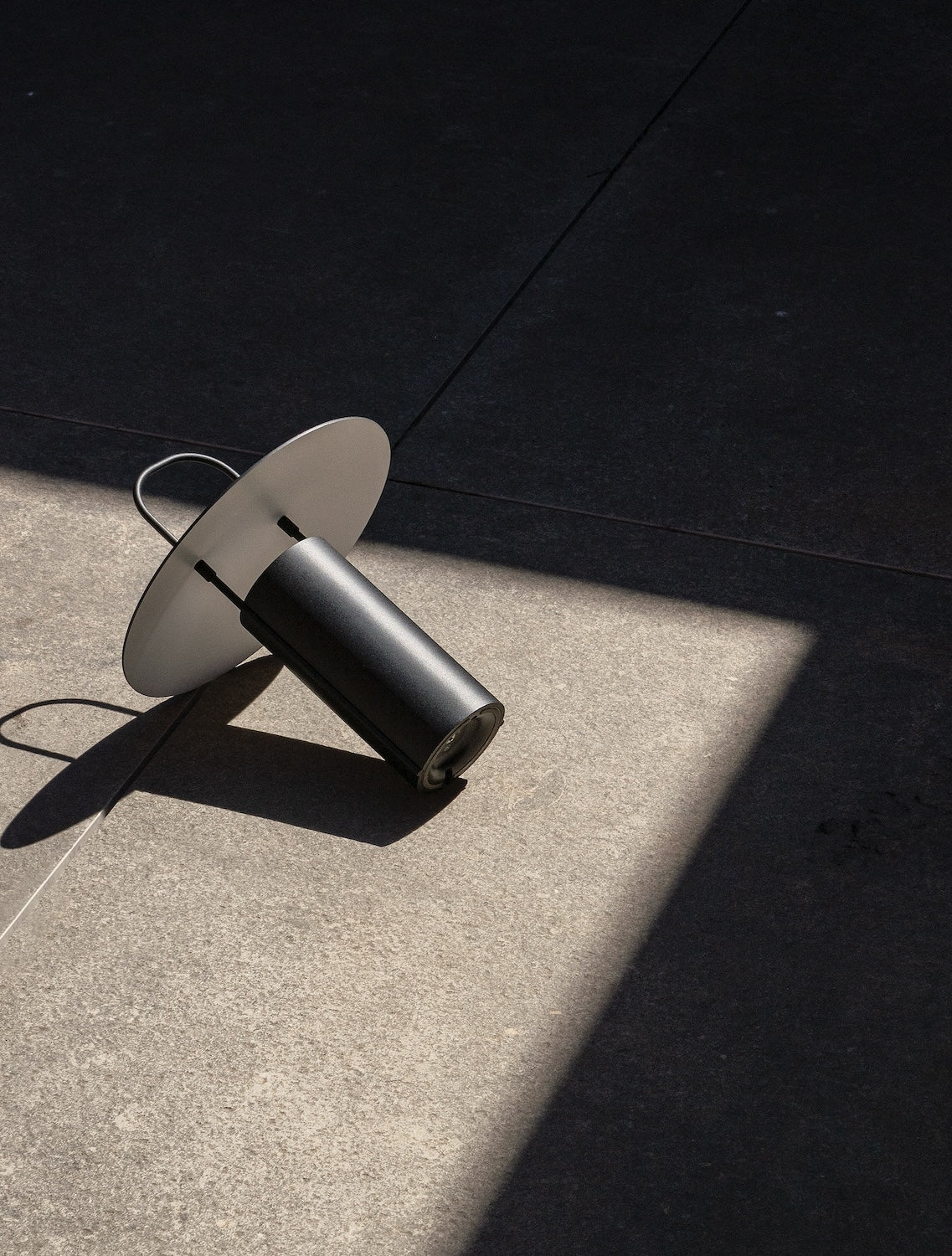 Ray Portable Lamp Black by Daniel Schofield for Audo Copenhagen (Menu) product photo on the ground