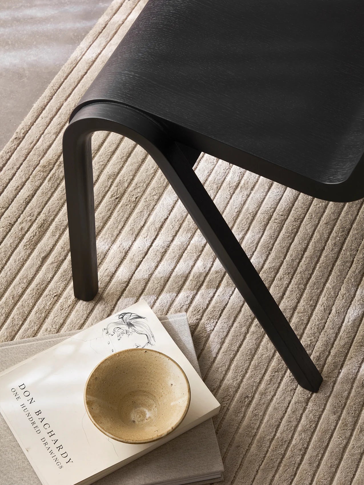 A close up of the Ready Dining Chair Black Painted Oak by Audo Copenhagen.