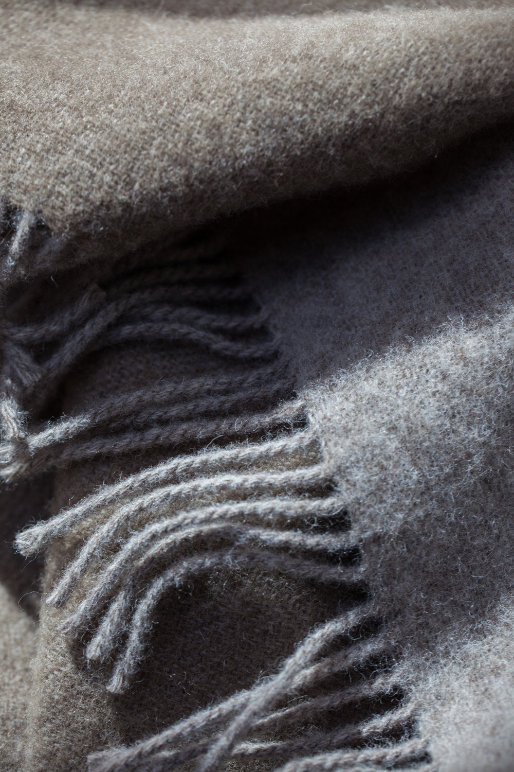 Close-up of the Forestry Wool Blanket, highlighting its natural wool composition. A luxurious and comforting addition to your home.