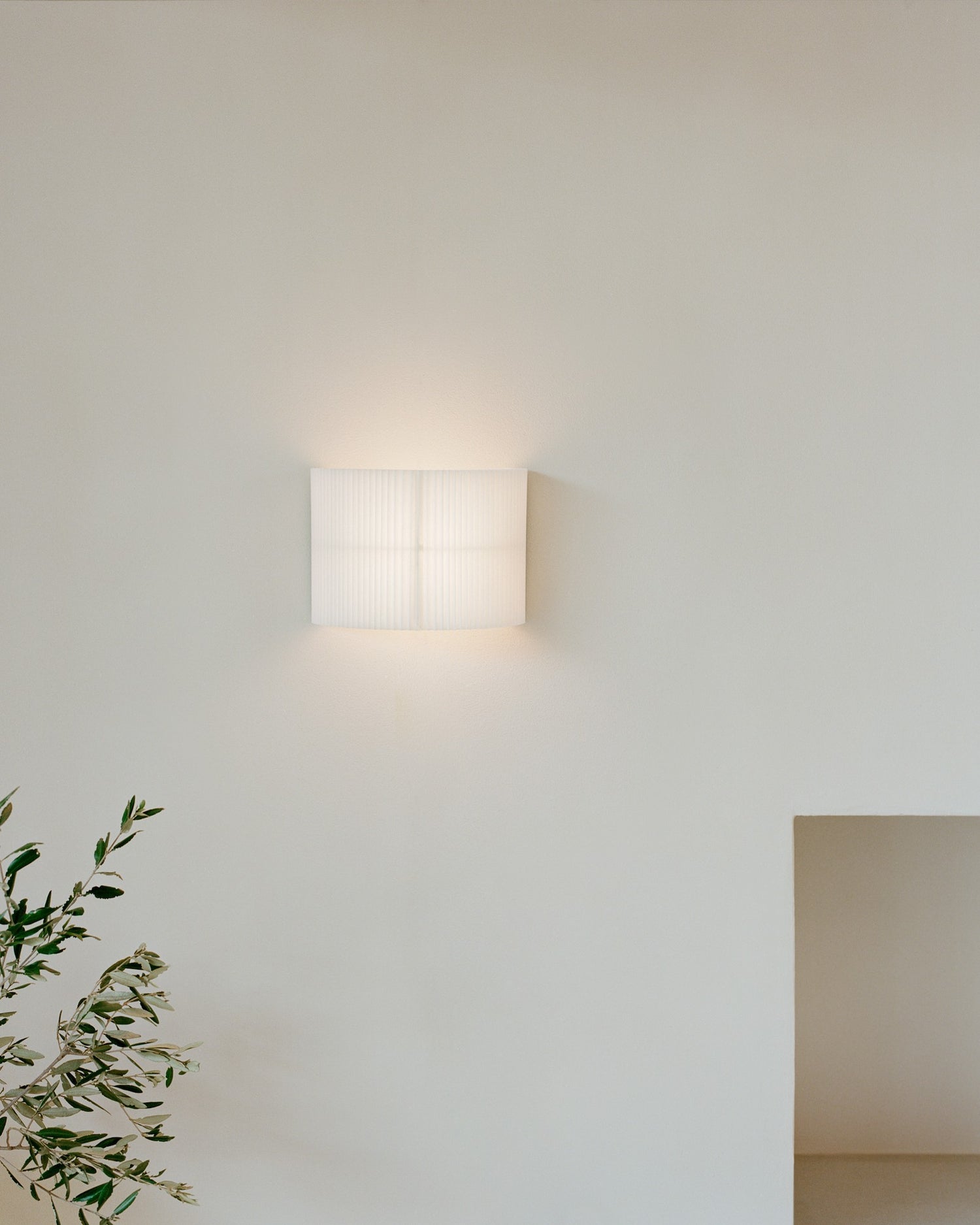 Nebra Wall Lamp by New Works, on ceiling with shade straight