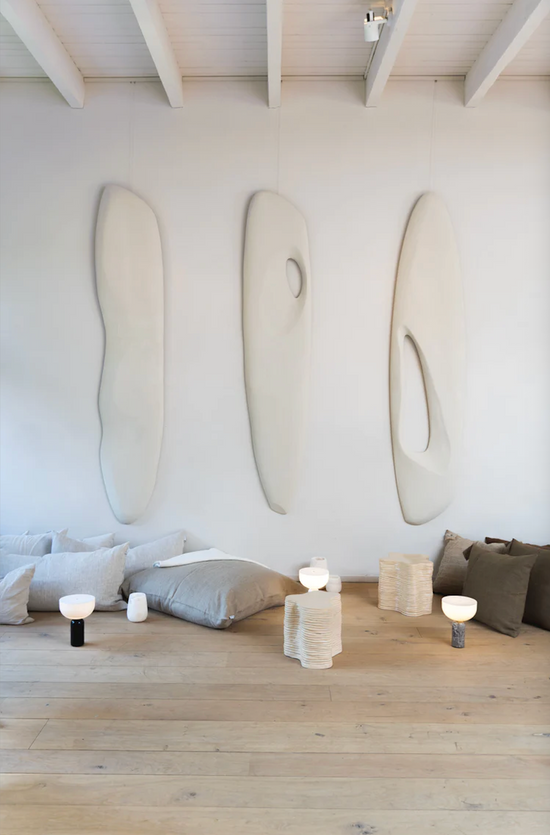 The big white Wall Sculptures n.1 & n.2 & n.3 by Atelier de Rijk hanging on a wall.