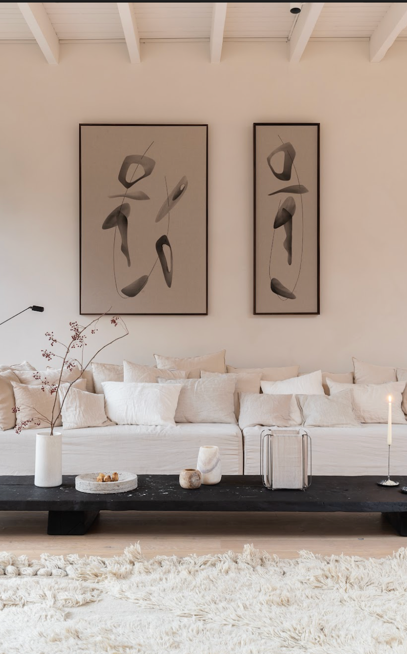 Symbiosis n.9 & n.10 abstract paintings by Atelier de Rijk hanging above a white couch by Gervasoni with cushions from Timeless Linen.