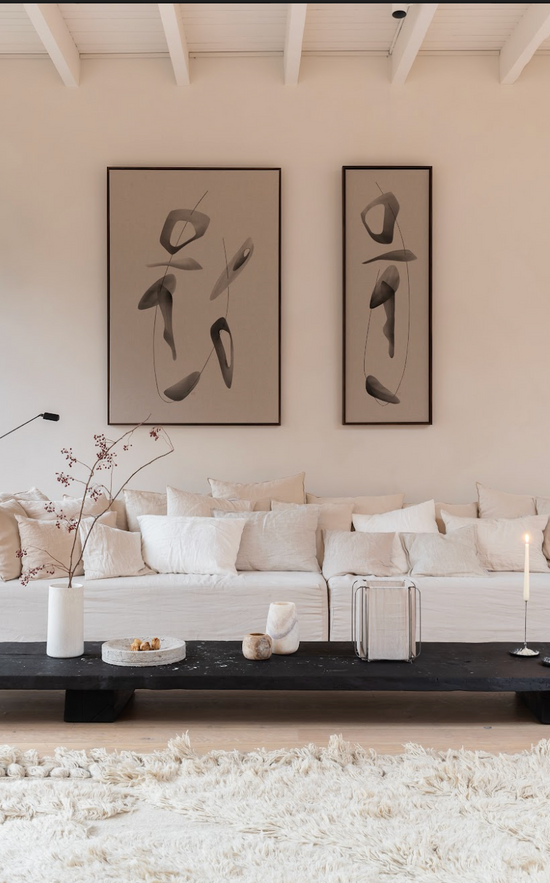 Symbiosis n.9 & n.10 abstract paintings by Atelier de Rijk hanging above a white couch by Gervasoni with cushions from Timeless Linen.