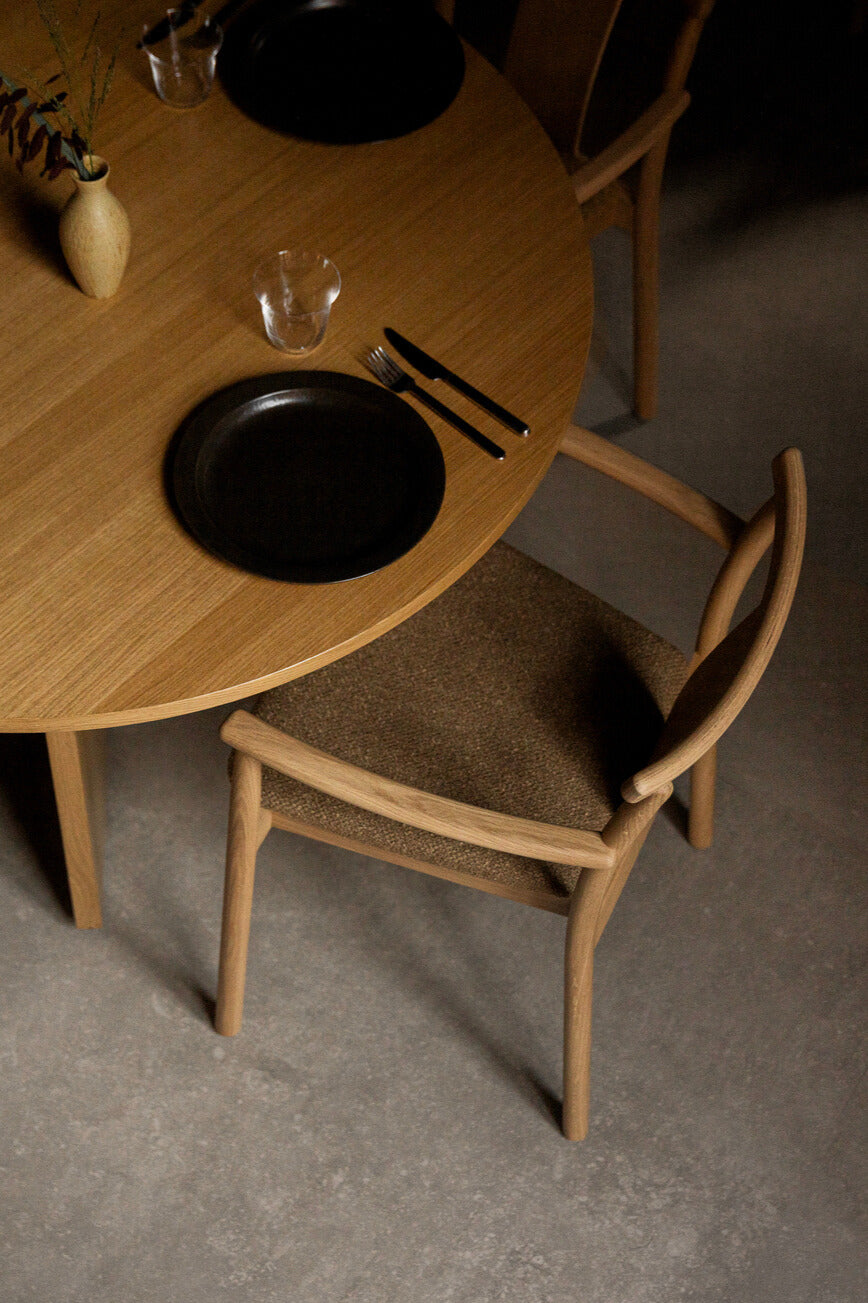 The Merkur Dining Chair by Audo Copenhagen with upholstery: Audo Boucle 06