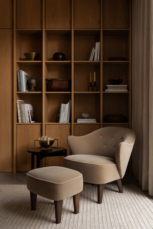 Ingeborg Ottoman and chair by Audo CPH for a wall cabinet.