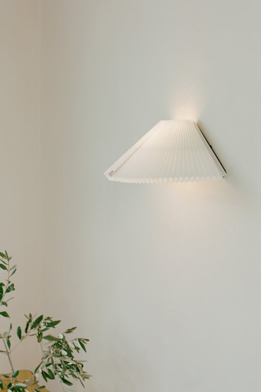 Nebra Wall Lamp by New Works, on ceiling with shade turned down