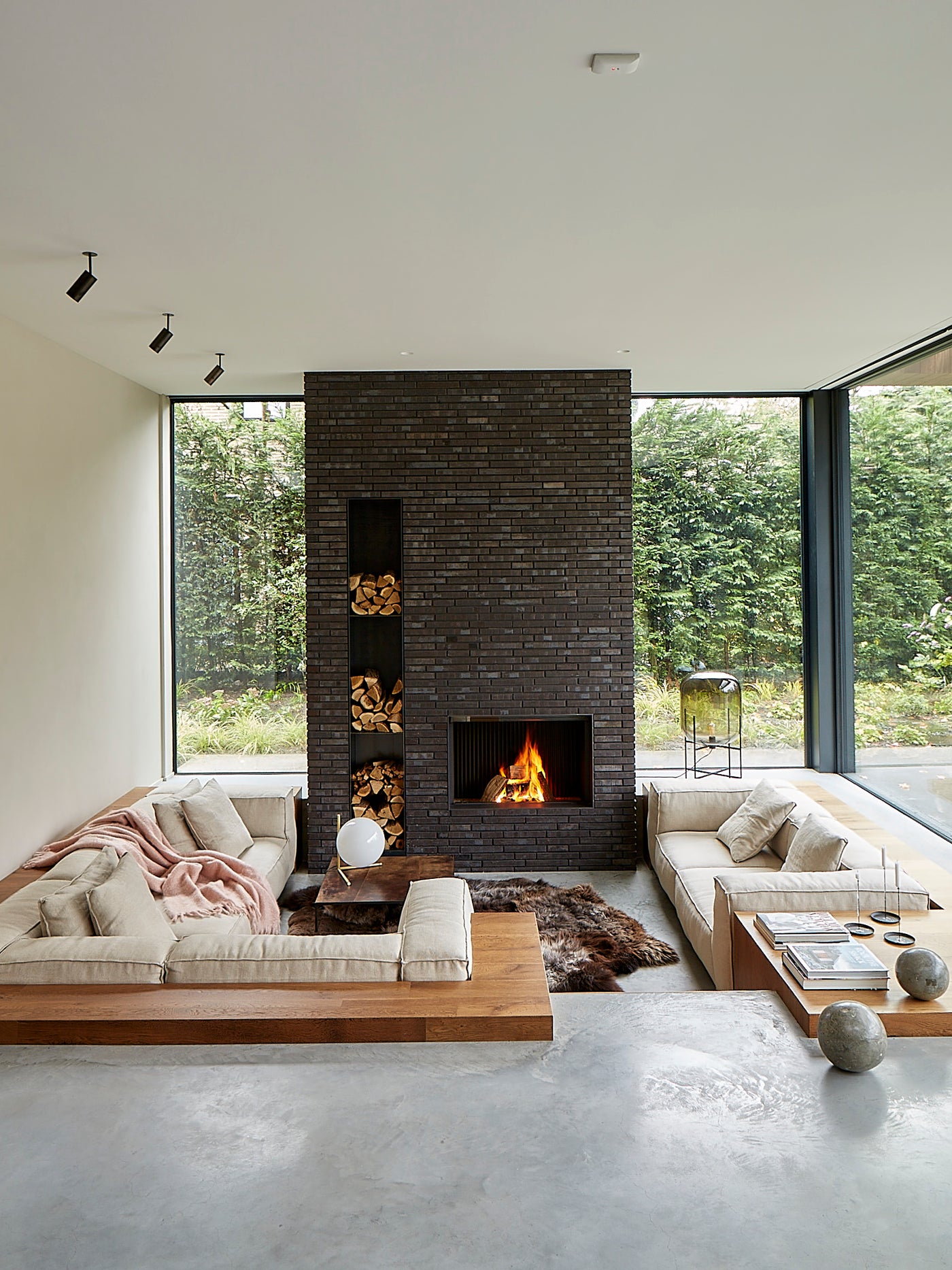Sunken living room area with windows and fire place - Artempo Interior Architecture Design - Kasia Gatkowska for ELLE