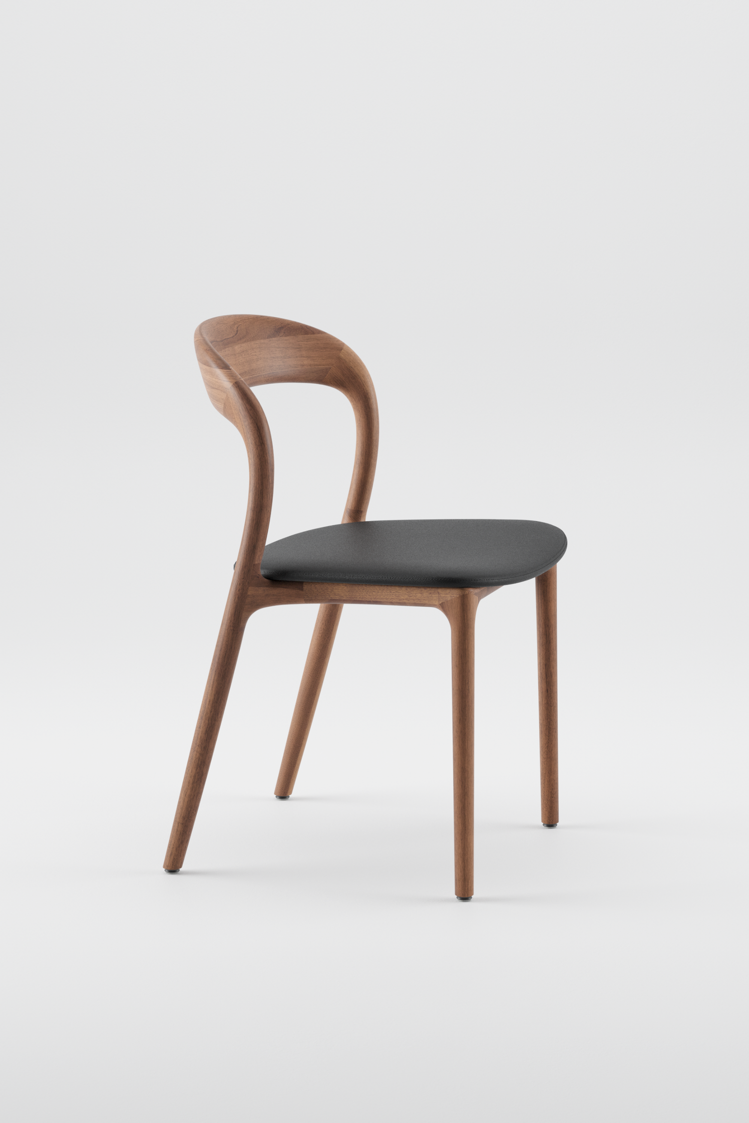 The Neva Dining Chair in Walnut with Upholstered Seat in Leather by Artisan