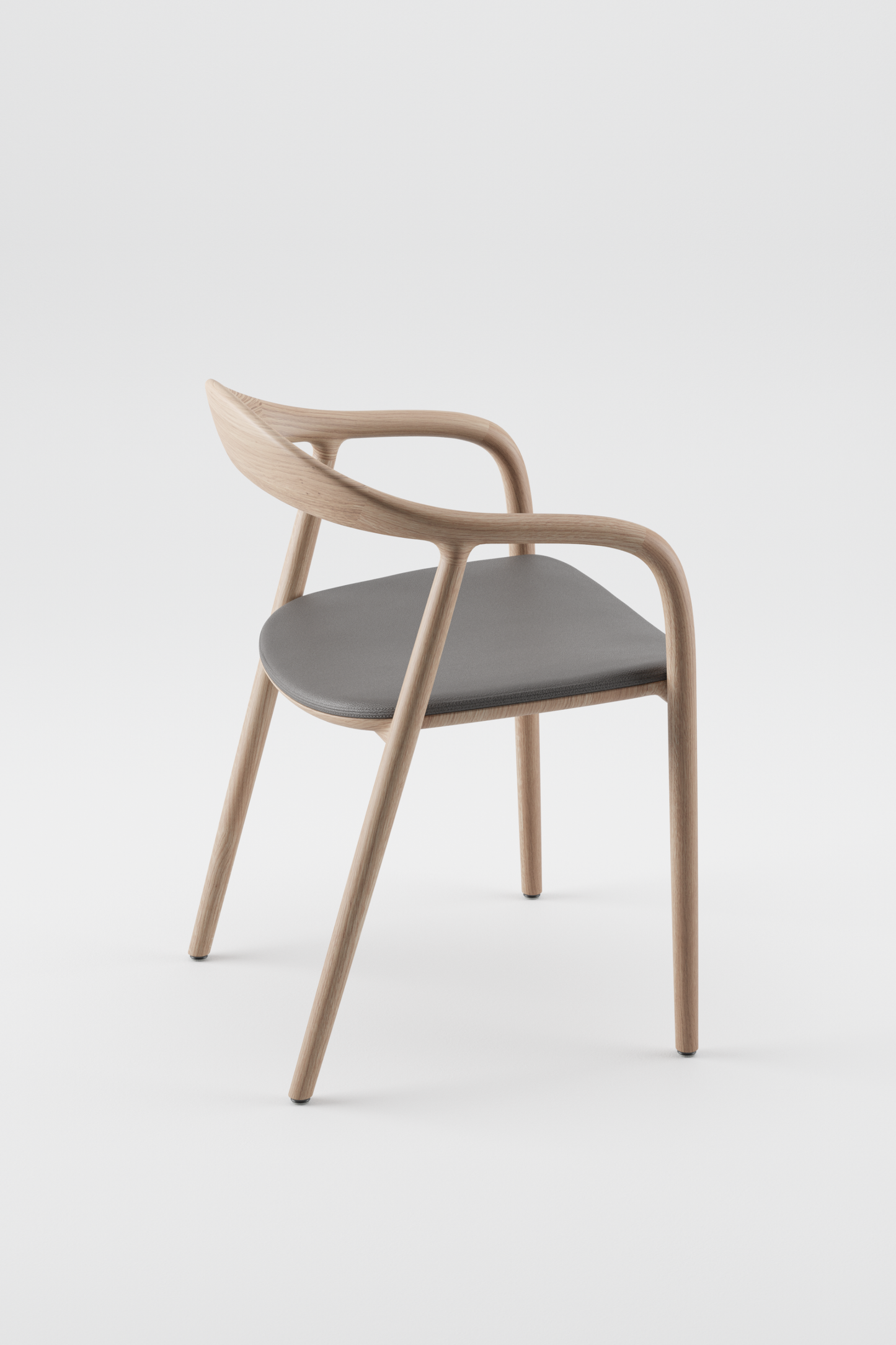 The Neva Chair Oak with Armrest and Upholstered Seat in Leather by Artisan