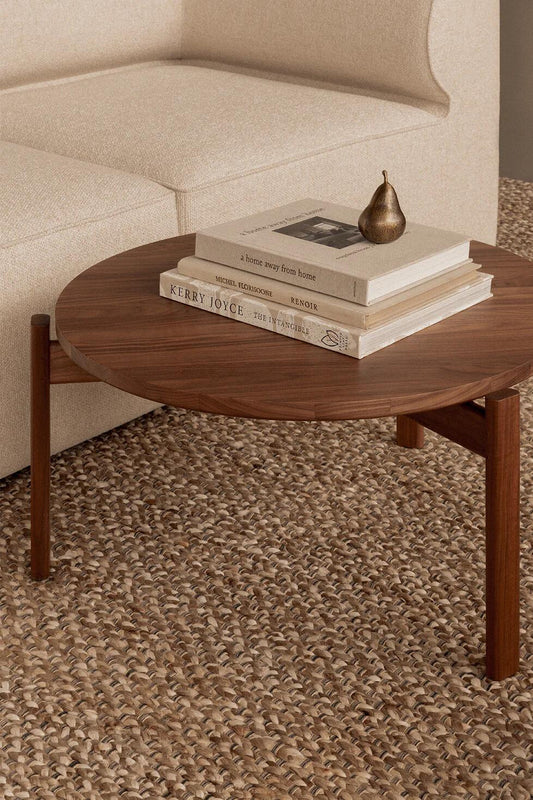 The Passage Lounge Table with interior books and the Sentiment Paper Weight Brass from Audo Copenhagen