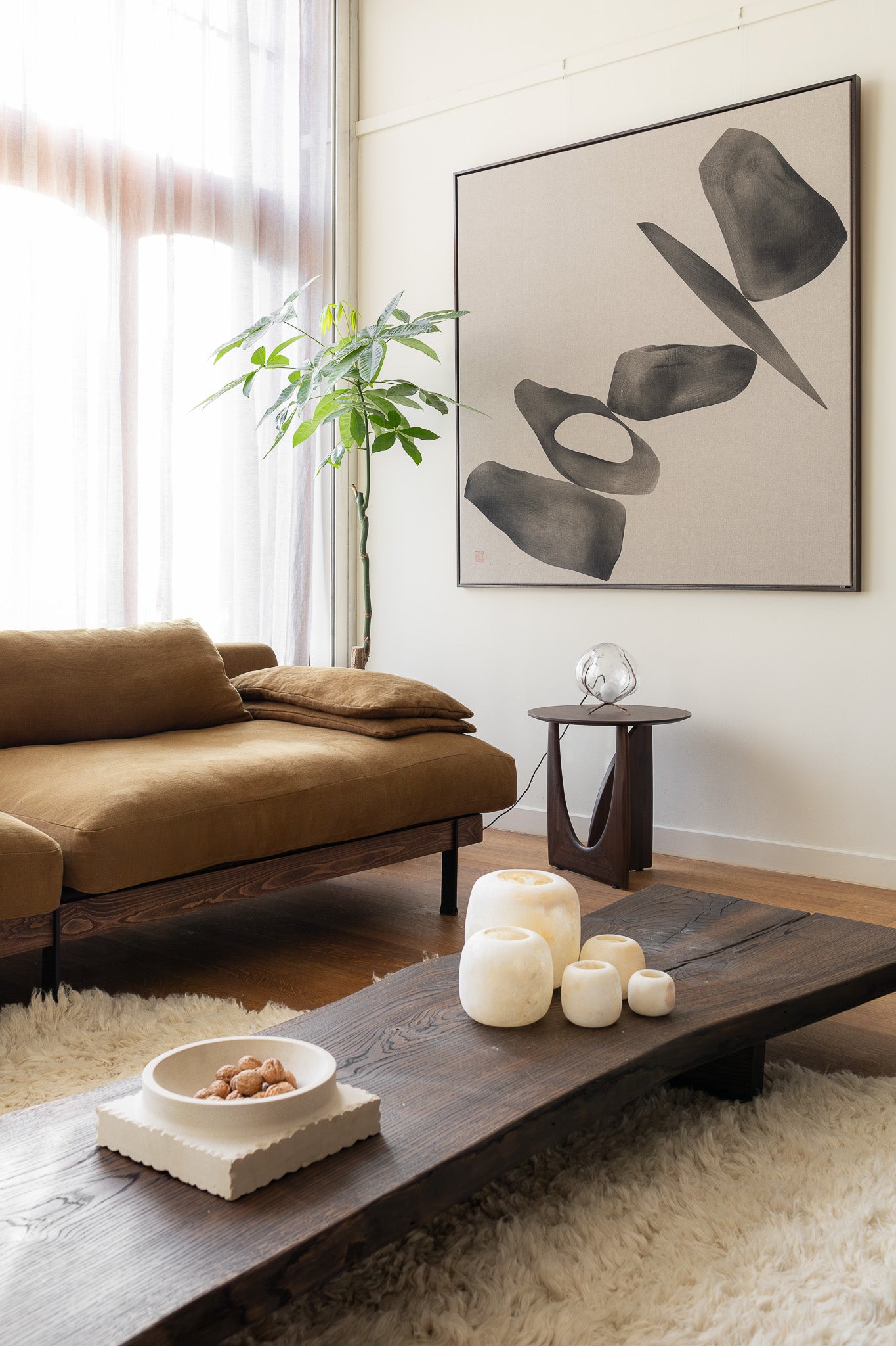 Sofa Ciel in Japandi interior with antique brown coffee table and artwork by Atelier de Rijk