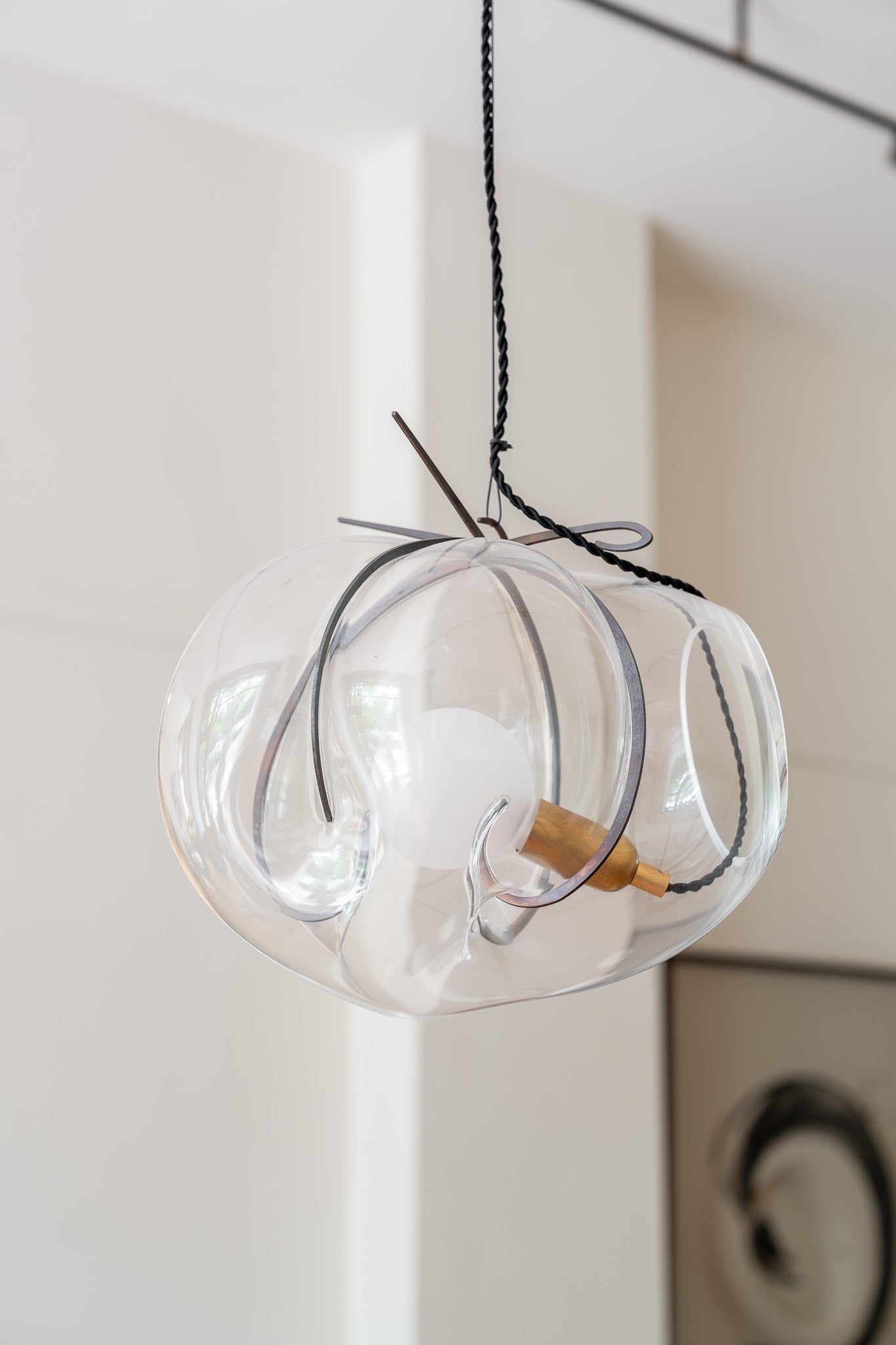 Exhale Pendant Lamp by WDSTCK. A hanging glass bubble with metal frame.