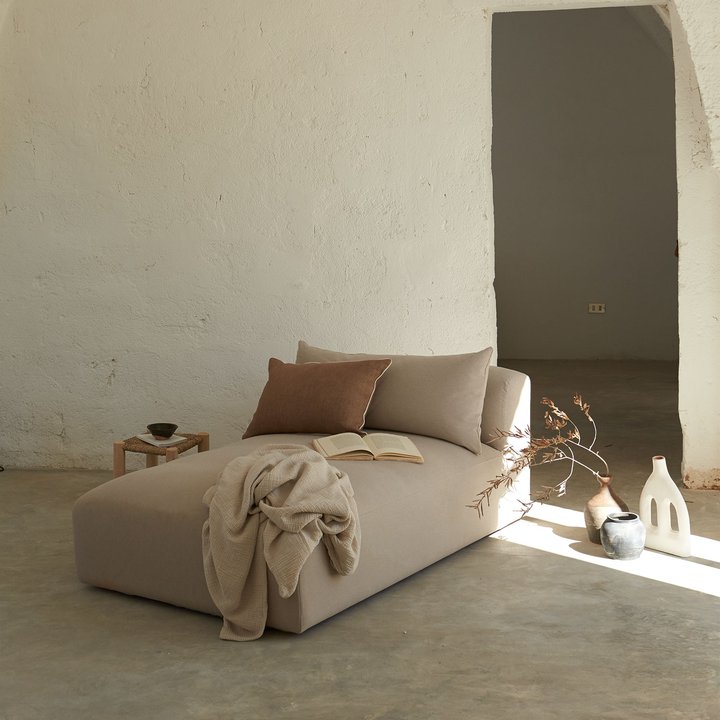 sofa module long by tine K with grey floor  and terracotta details and some pottery accessoiry.