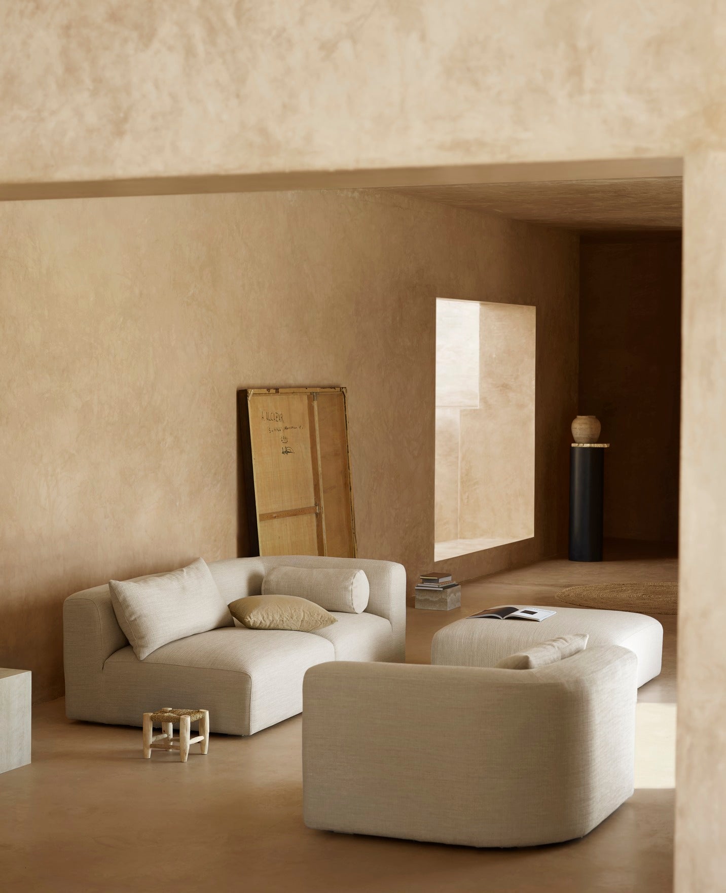Sofa module curved corner in mediteranian interior setting with micro cement