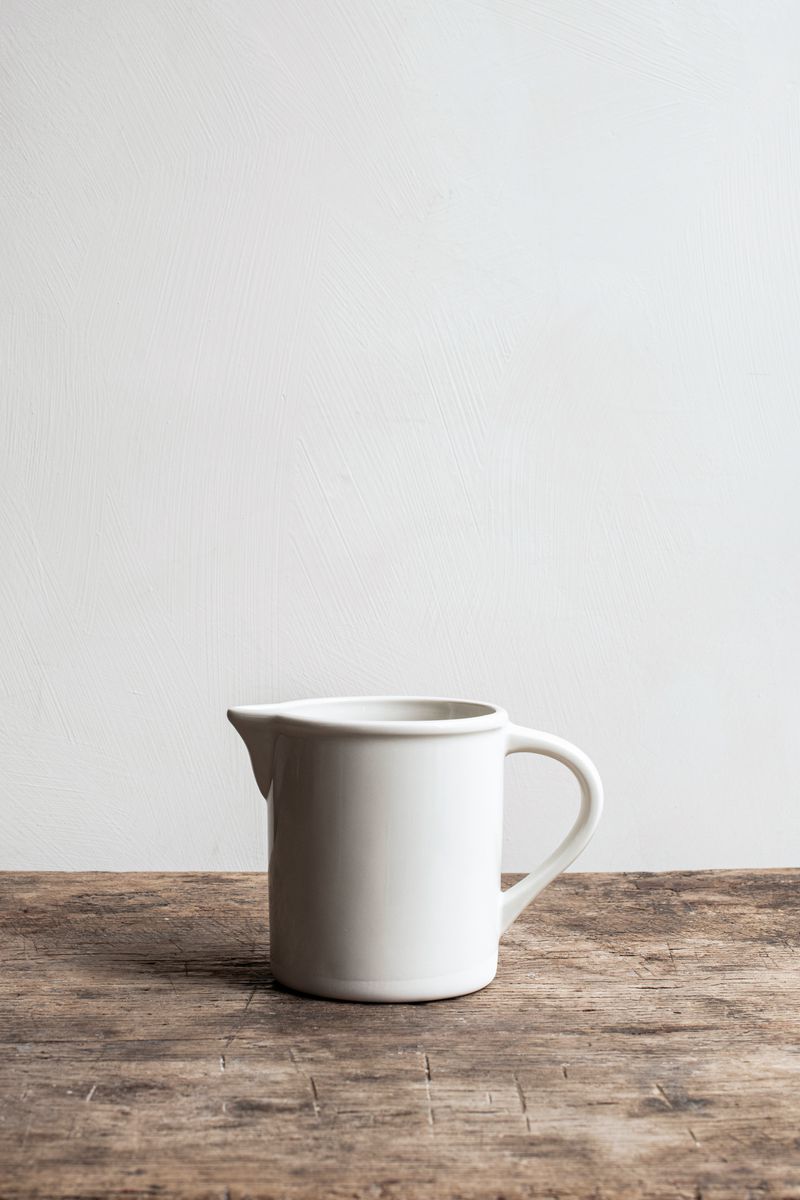 Roussillon Carafe White by Jars Ceramistes on wooden table.