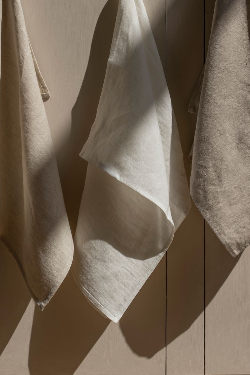 Close-up of three hanging linen tea towels by Timeless Linen.