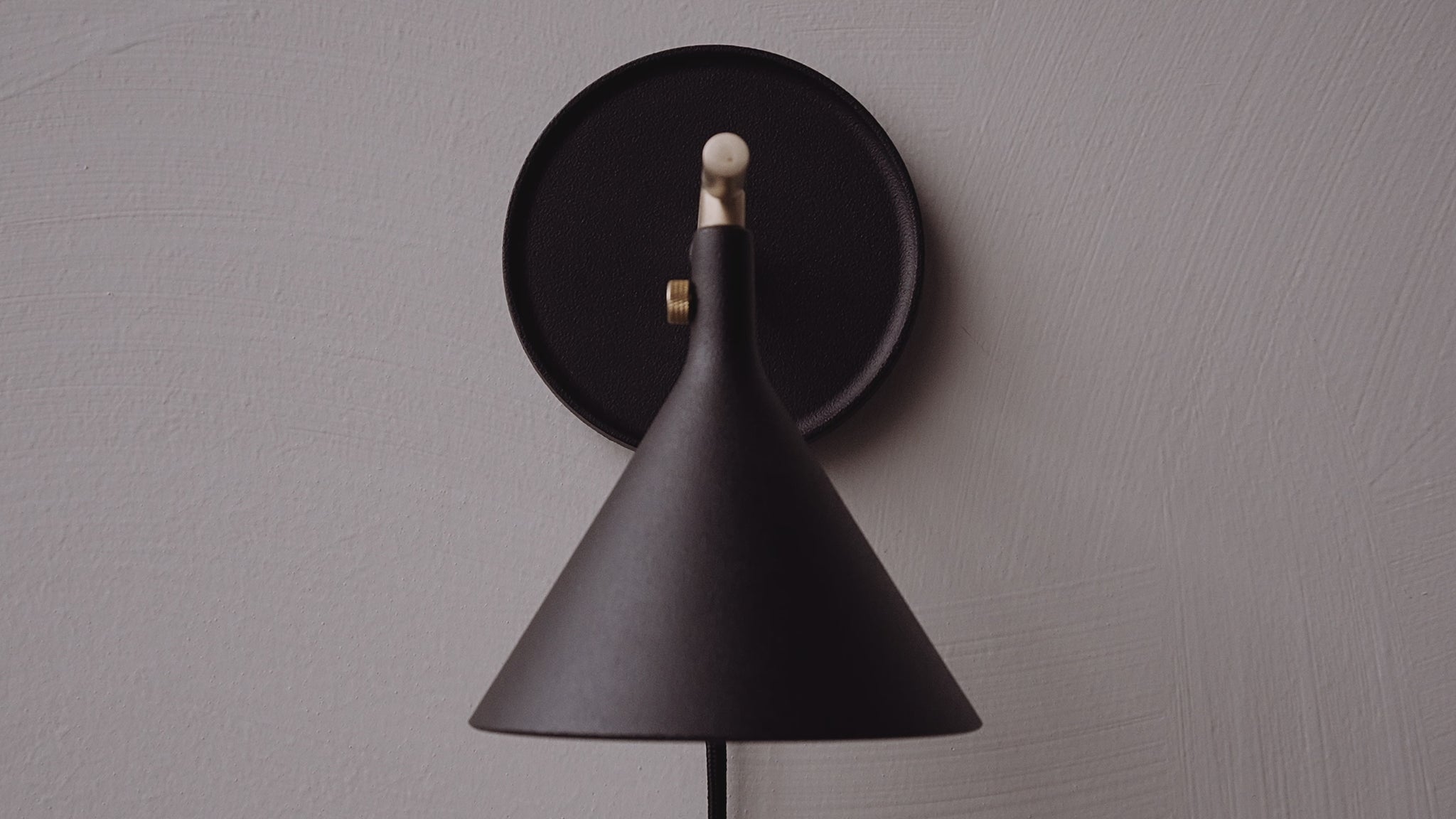 Video of the Cast Sconce Wall Lamp Diffuser, dimmer by Menu.