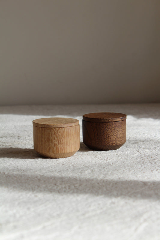 Salt Me by Ekta Living, a stylish and functional salt cellar. Features a modern design with a wooden container and lid.