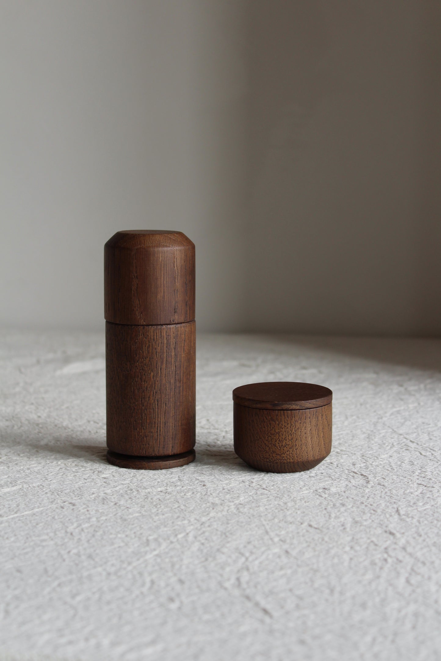 Dark smoked oak pepper grinder and salt jar from the brand EKTA Living