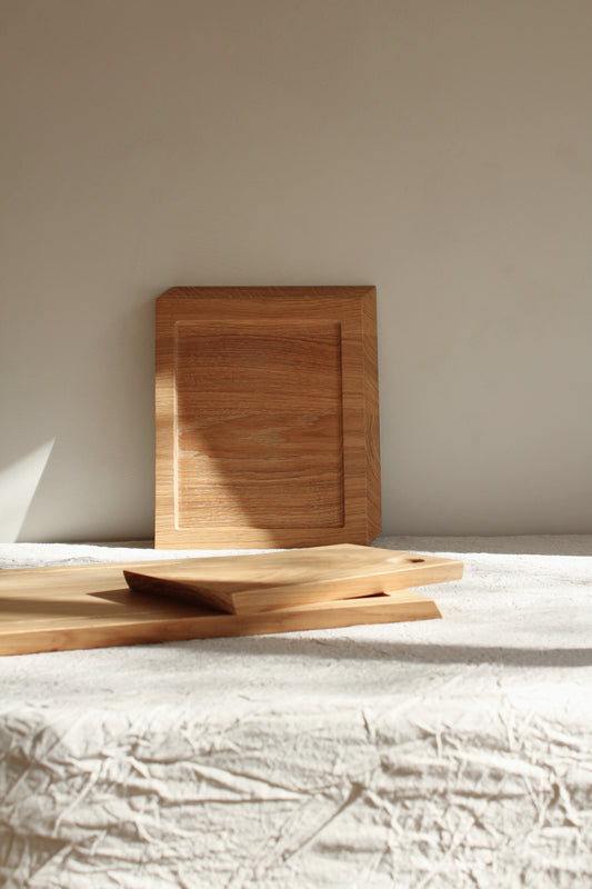Cutting board made from high-quality wood. Durable and versatile, ideal for food preparation and serving.