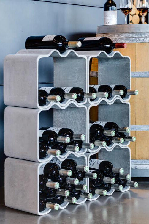 The Sponeck Wine Rack by Julia von Sponeck. The industrial and luxurious design made from a fibre cement panel is formed to be stackable.