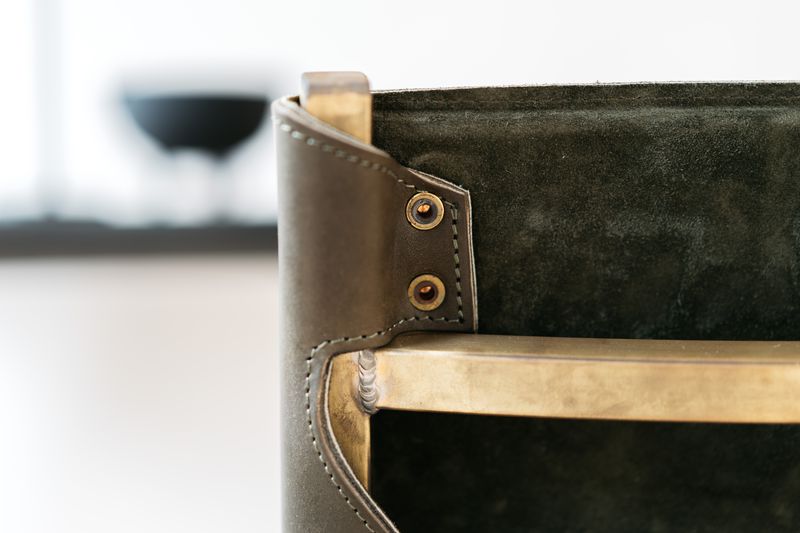 Close-up of the craftsmanship in the Memento Chair with Brass Frame