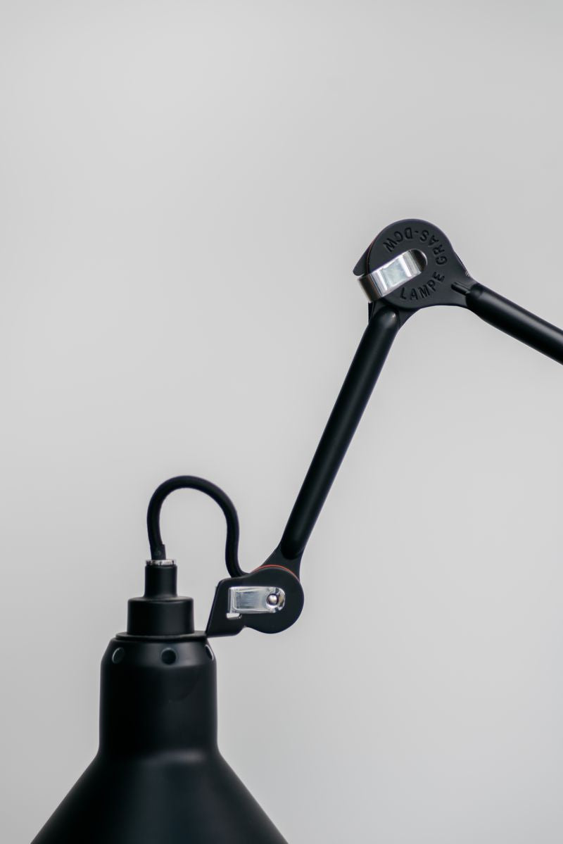 Close-up of the Lampe Gras N°201 desk lamp showcasing its intricate details and smooth curves. Timeless elegance in black.