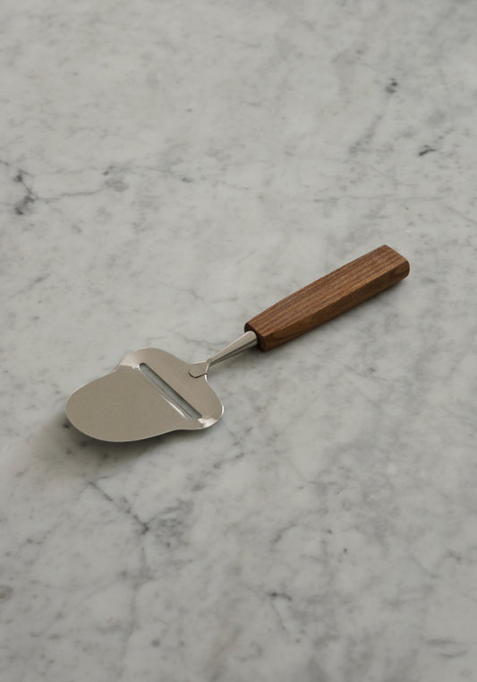 Cheese Slicer with Elm Wood handle on marble background