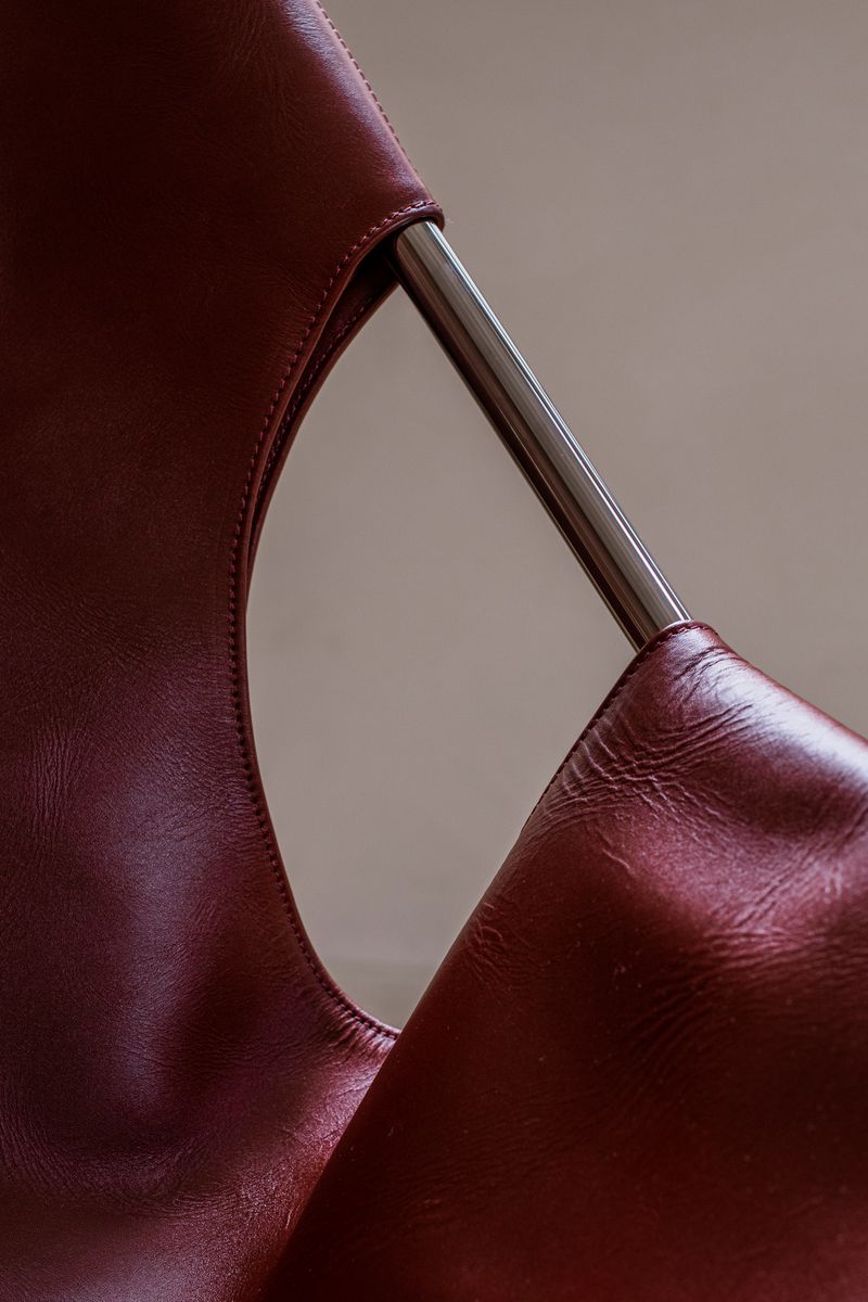 Details of the Stainless Steel Frame and Cognac Leather of the Paulistano Chair by Objekto.