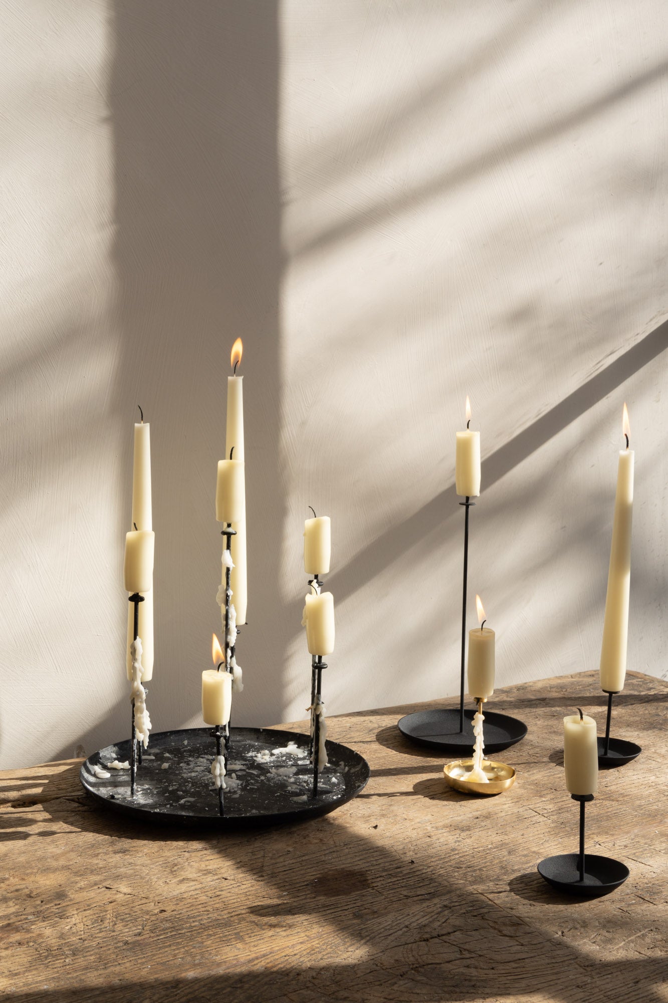 Different lengths of candles on the multi candle pin holder, highlighting its compact and versatile design. Ideal for creating stylish and secure candle setups.