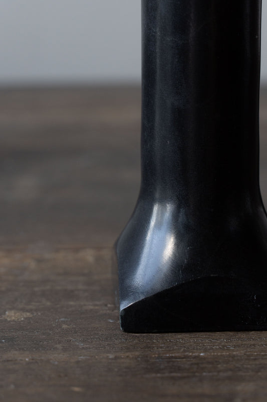 Close-up of the soapstone candleholder, showcasing its smooth texture and natural variations.