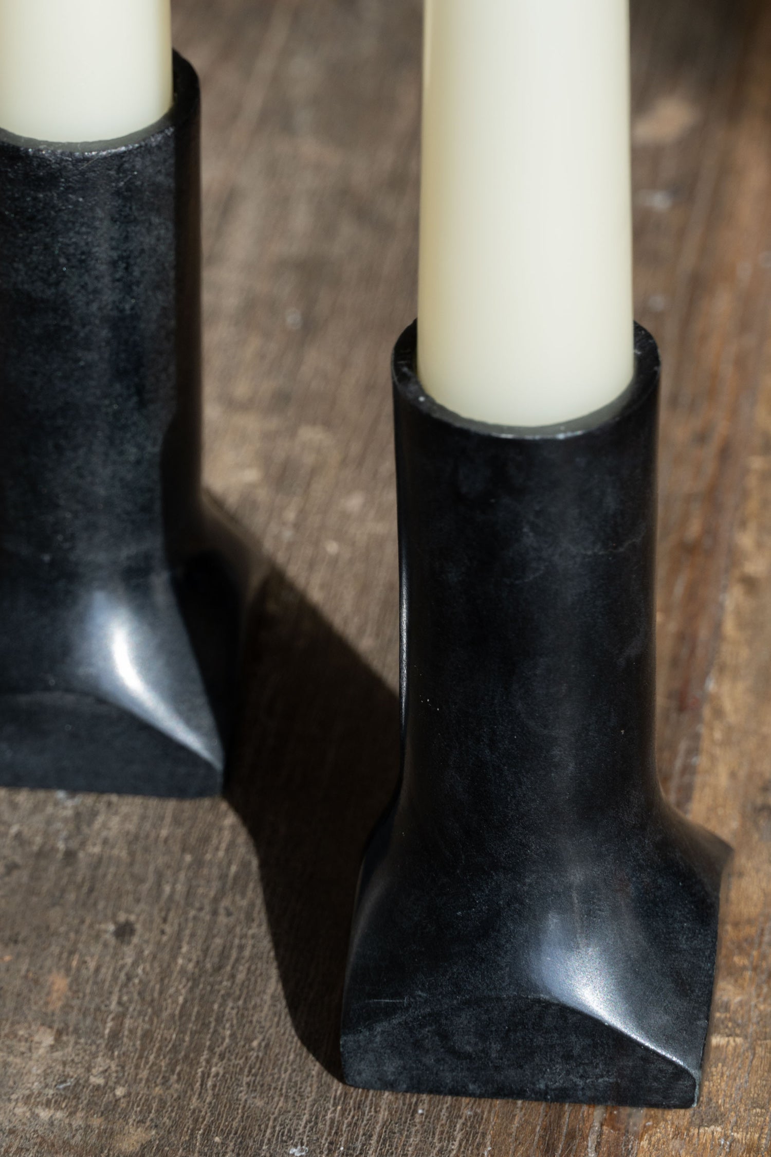Close-up of the soapstone candleholder, showcasing its smooth texture and natural variations.