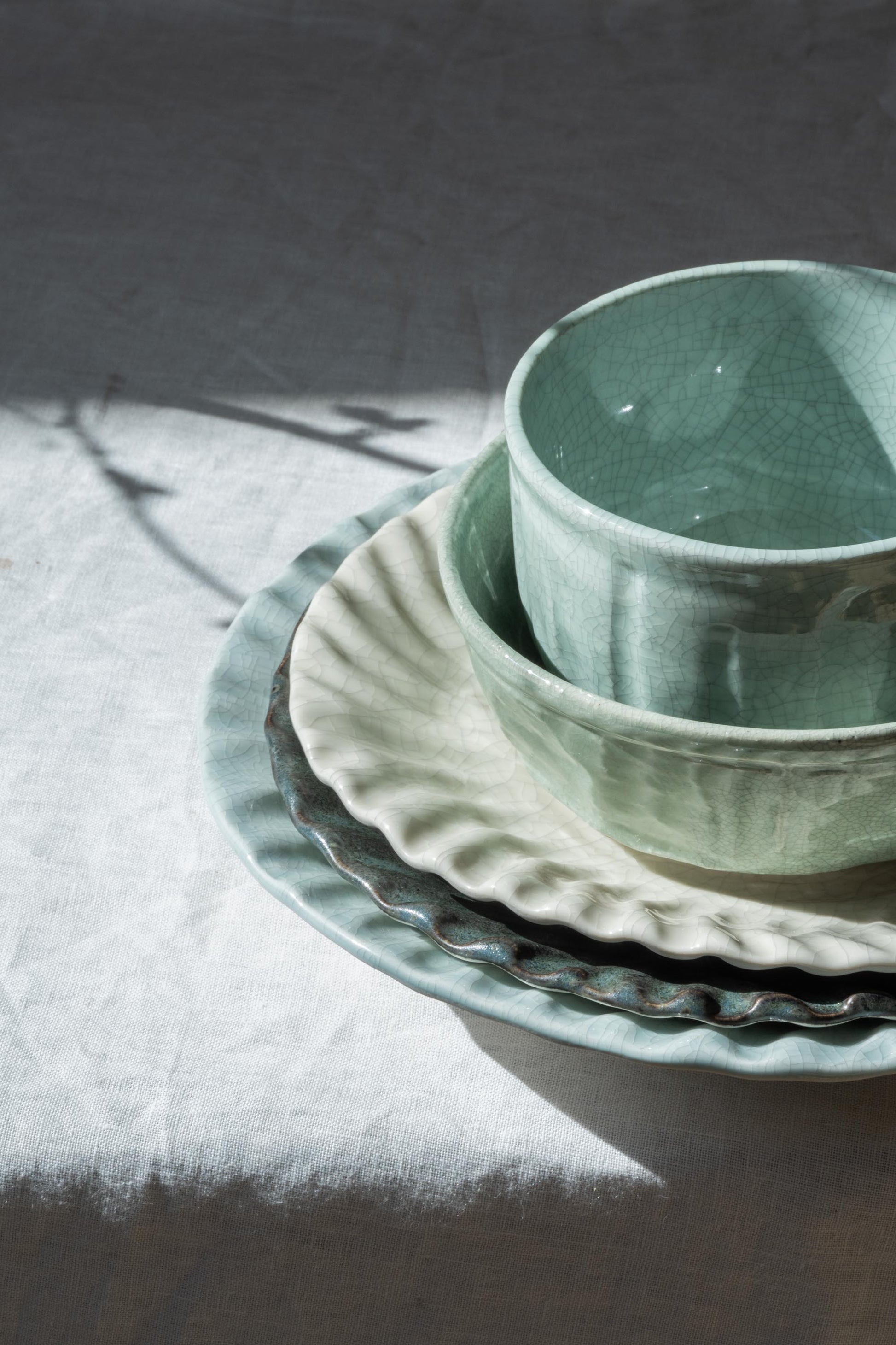 Stack of Dashi Plates and Cups by Jars Ceramistes.