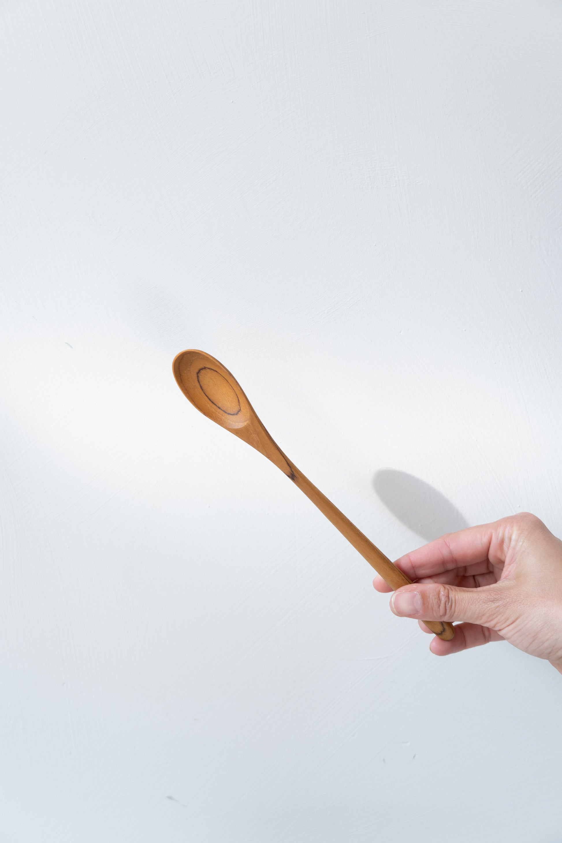 Juice Spoon Reclaimed Teak in hand