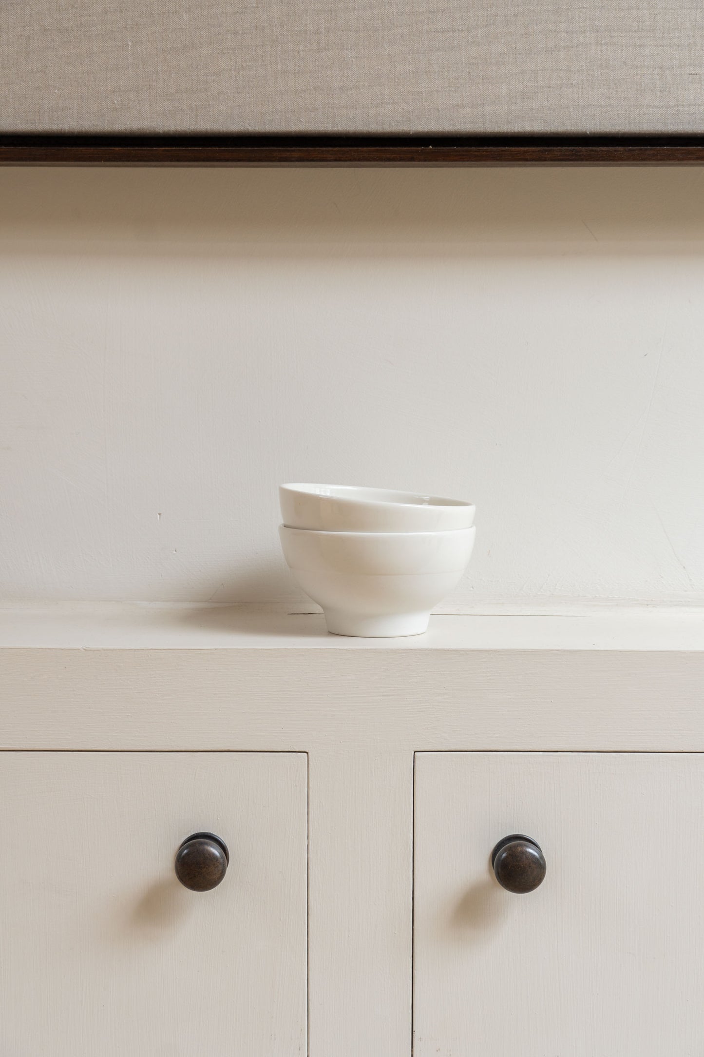 Two stacked white Antibes Bowls by Jars Ceramistes.