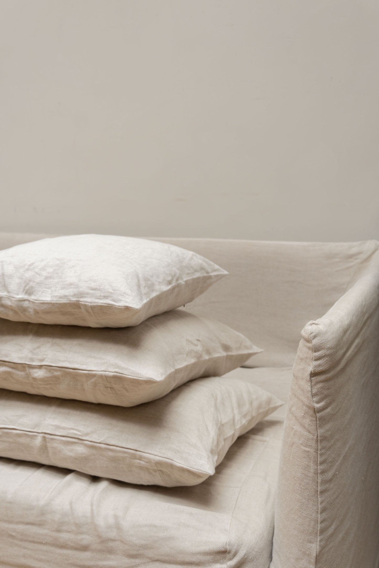 Stack of Linen Cushions by Timeless Linen in the colour Oatmeal.