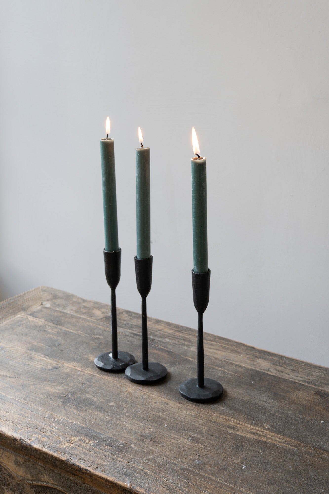 Three Dinner Candles in Forest Green by The Loft Selects.