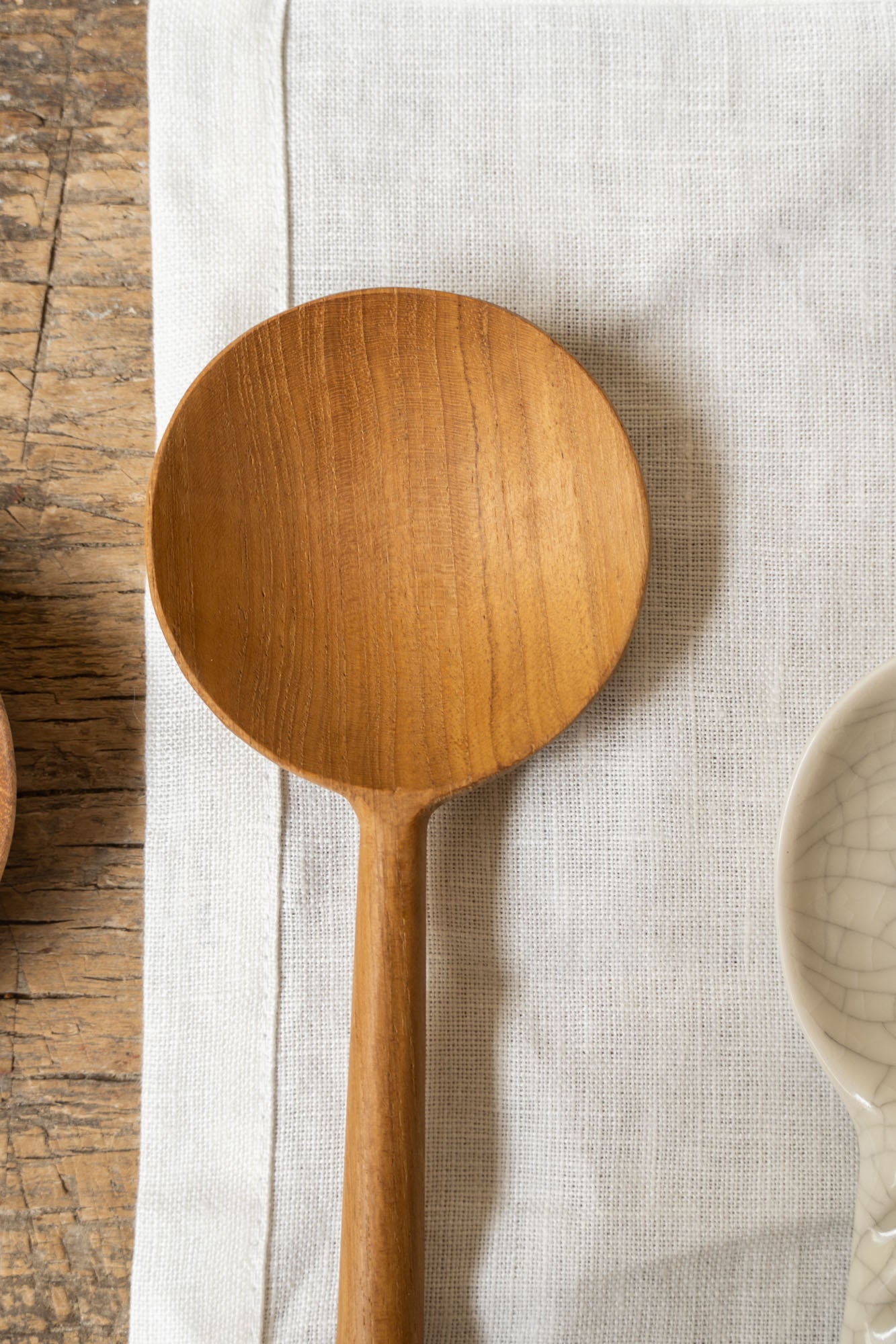 Close-up of the Round Spoon Reclaimed - L by The Loft Selects.